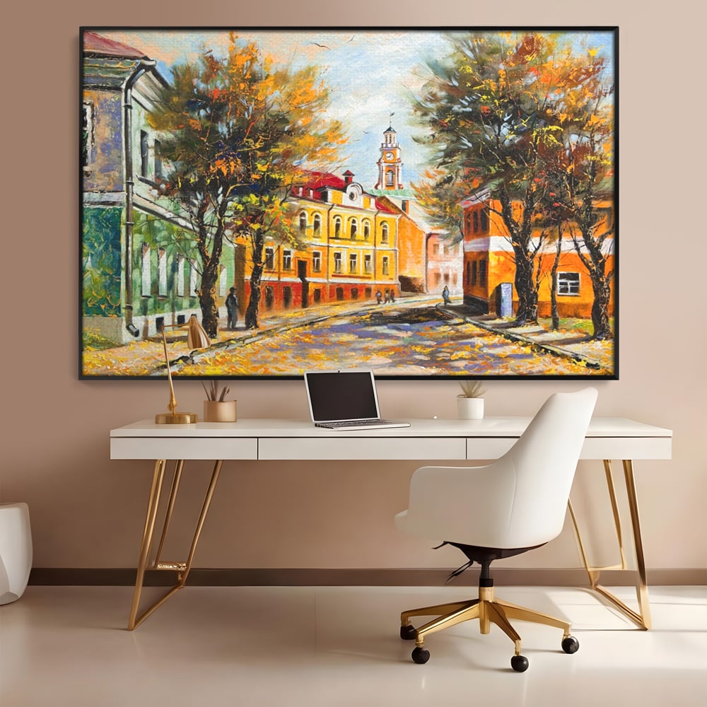 Tablou canvas cu pictura stradala cu peisaj de toamna, in rama de aluminiu negru, pe perete intr-un birou
